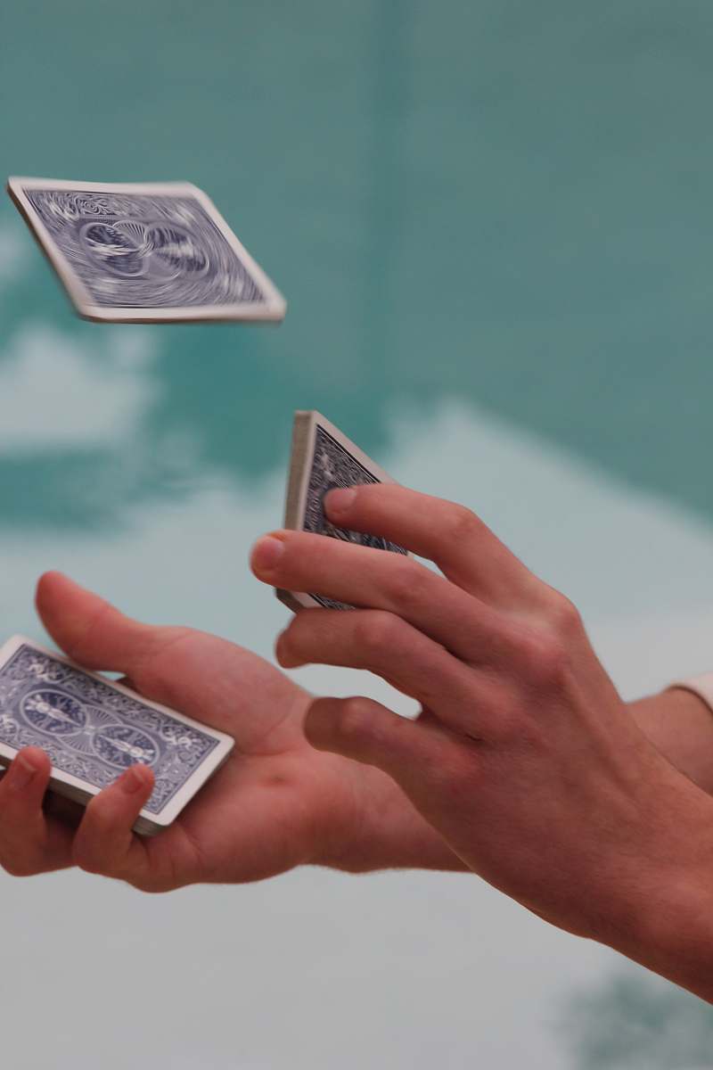 card unknown person shuffling playing cards hand